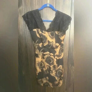 Y2K slip dress with lace trim and gold flower accents. Size Small.